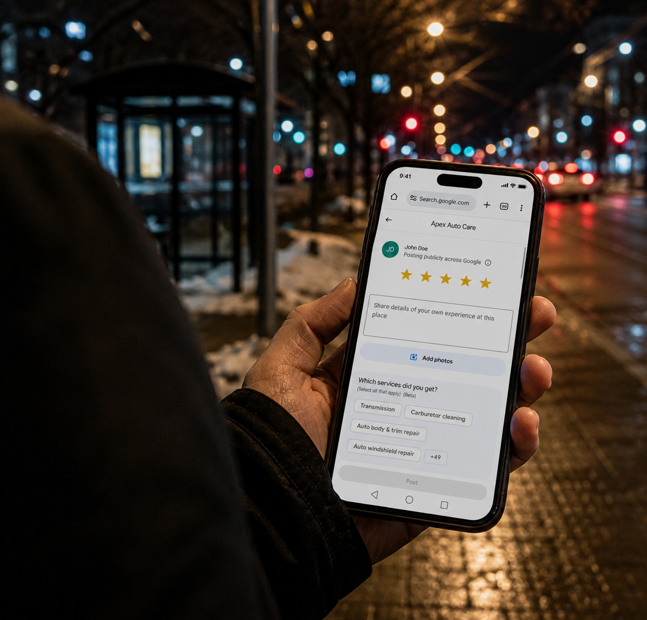 Person holding phone showing a Google review