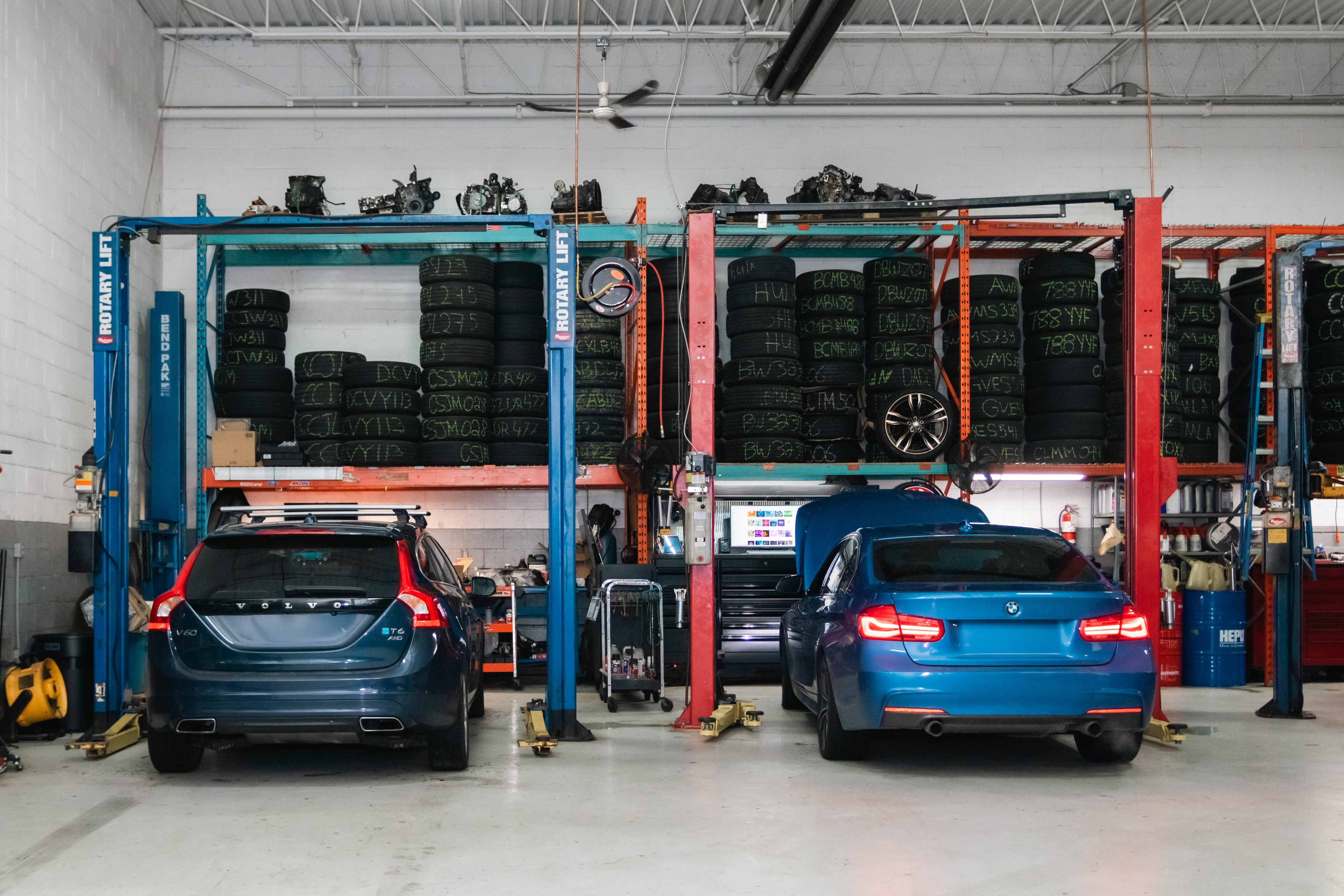 Tire shop with multiple vehicles on lifts